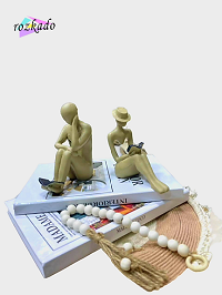 مجسمه دکوری زوج کتابخوان